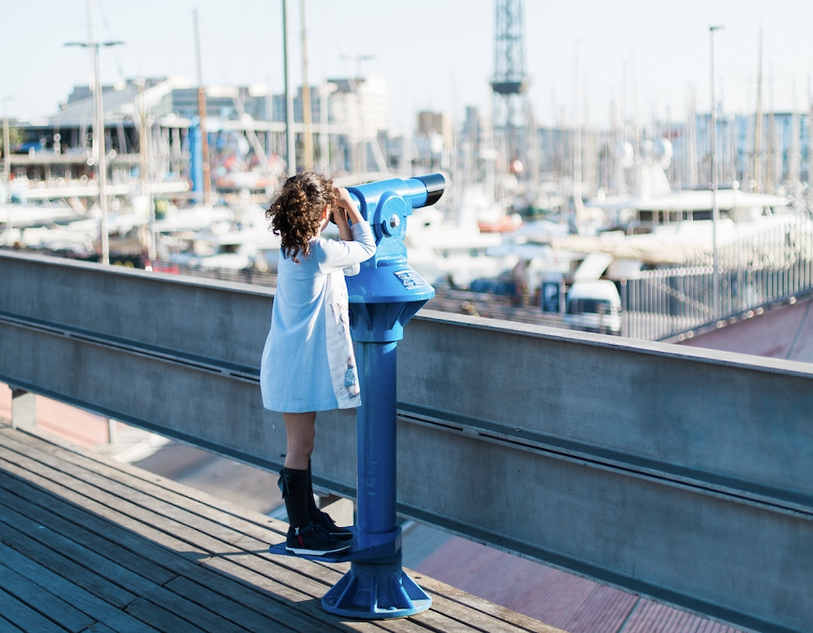 Young girl with telescope 